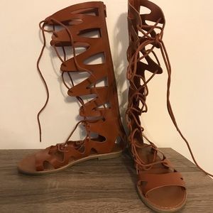 Below the knee gladiator tie sandals